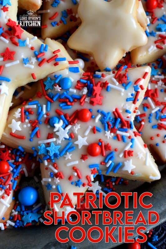 A classic, old-fashioned shortbread recipe is the basis of this festively decorated and garnished, beautiful Patriotic Glazed Shortbread Cookies. These are gorgeous and look super appealing. They make a great gift idea too! The light, buttery, crisp cookie stands up well to the shiny, sugary icing! #patriotic #4thofjuly #independenceday #baking #redwhiteandblue #redwhite&blue #cookies #sprinkles #shortbread