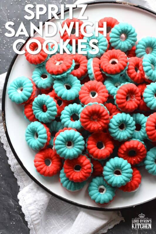 Everyone loves a spritz cookie, especially at Christmas! But, why should they only make an appearance once a year? In this version, I've coloured the cookie dough red and blue and sandwiched them with white frosting. These are most certainly bright and festive - perfect for your 4th of July celebrations! #spritz #cookies #sandwichcookies #redwhiteblue #4thofjuly #redwhiteandblue