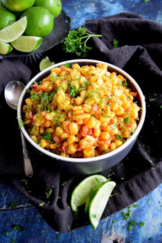 Light and refreshing, a simple combination of corn and radish, paired with a light oil and vinegar dressing and a burst of fresh lime juice, Corn and Radish Salad is a perfect summer side dish to any grilled main! #salad #summersalad #cornsalad #radish #lime