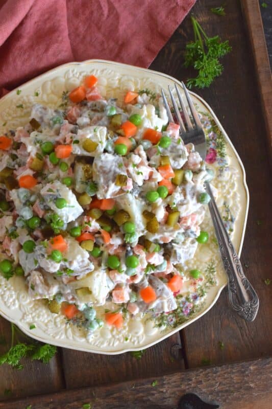 The combination of chicken and some version of a potato recipe has always been a classic meal, so why not combine the two? Chicken and Potato Salad is a mayonnaise-based, creamy salad prepared with peas, carrots, chives, and pickles too! This salad is a meal in itself, but also, perfectly and easily paired with any backyard BBQ mains! #potatosalad #chicken #salad #summermeals #sides #summersides