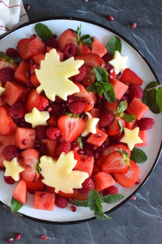 So easy and so much fun to prepare, this Canada Day Fruit and Berry Platter is as pretty to look at as it is good to eat! Using only red fruit and berries, and a little bit of garnish, make this the center of your celebratory table this coming Canada Day weekend! #canadaday #redandwhite #partyfood #picnic #fruit #berries