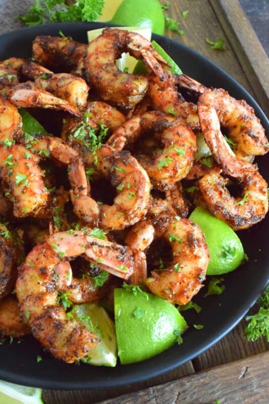 Marinated in a mixture of warming dried herbs and spices with a splash of olive oil and a spritz of fresh lime juice, these Grilled Chili Lime Shrimp are bursting with flavour! Quickly grilled over high heat to get a good sear and colour without the risk of overcooking makes it hard to stop from eating them all! #grilled #shrimp #chililime #lime #jumboshrimp