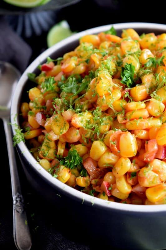 Light and refreshing, a simple combination of corn and radish, paired with a light oil and vinegar dressing and a burst of fresh lime juice, Corn and Radish Salad is a perfect summer side dish to any grilled main! #salad #summersalad #cornsalad #radish #lime