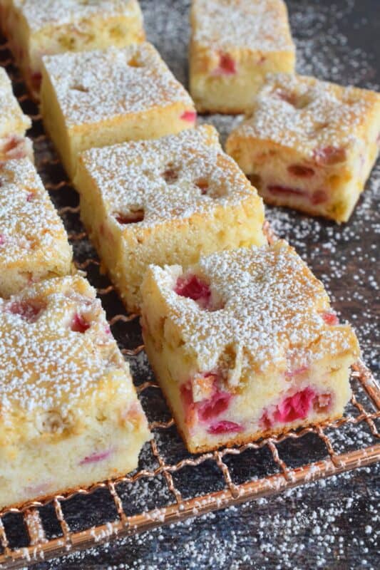 Perfectly sweet and puckeringly tart, 3 Ingredient Rhubarb Squares take thirty minutes from start to finish. These are a quick and easy treat which can be effortlessly whipped up when your neighbour announces they're dropping by for tea this afternoon. All in one bowl, so a simple clean up too! #rhubarb #squares #bars #cookies #3ingredient #dessert