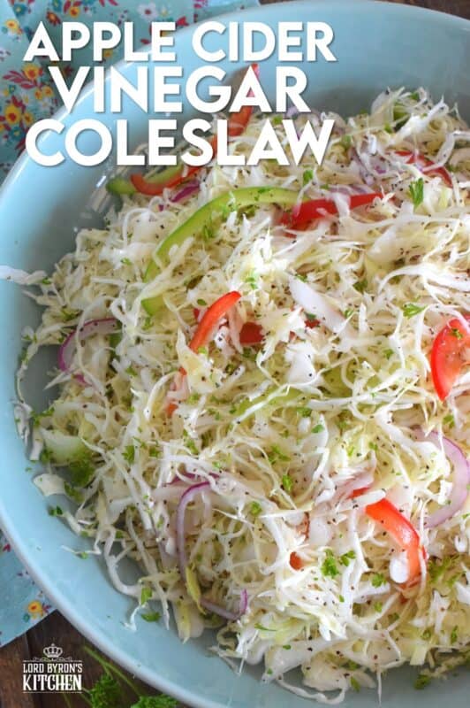 Apple Cider Vinegar Coleslaw is packed with robust flavours!  Like most coleslaw recipes, this one starts with shredded cabbage, but it is combined with red and green bell peppers, and thinly sliced red onions too.  Tossed in a sweet oil and vinegar dressing, it’s hard to say no to a second helping! #coleslaw #vinegary #applecider #salad #summersides