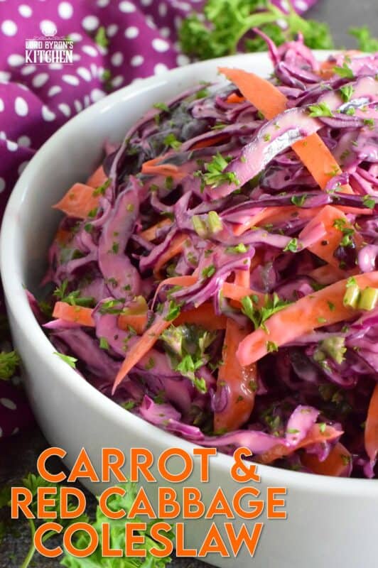 Carrot and Red Cabbage Coleslaw is the best of both worlds. It is a little bit creamy and a little bit vinegary, which is a combination of the two sides of the coleslaw debate. Vibrantly colourful and super crunchy, this coleslaw will brighten up any plate as a side, or make it a perfect addition to sandwiches, tacos, burritos, burgers, and hot dogs too! #redcabbage #coleslaw #salad #celery #creamy #seeds
