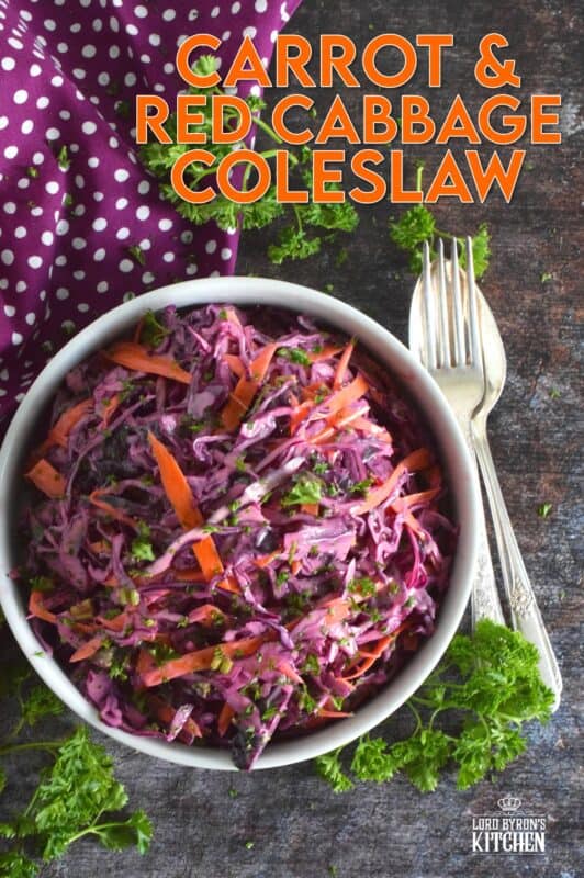 Carrot and Red Cabbage Coleslaw is the best of both worlds. It is a little bit creamy and a little bit vinegary, which is a combination of the two sides of the coleslaw debate. Vibrantly colourful and super crunchy, this coleslaw will brighten up any plate as a side, or make it a perfect addition to sandwiches, tacos, burritos, burgers, and hot dogs too! #redcabbage #coleslaw #salad #celery #creamy #seeds