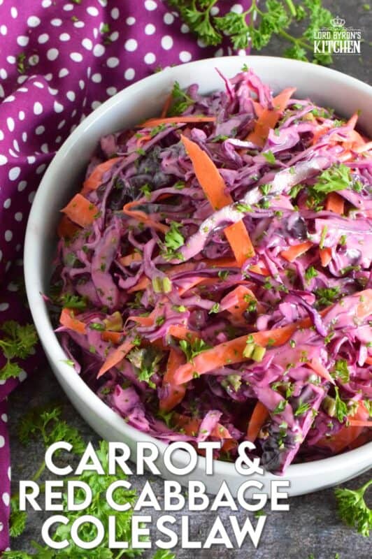 Carrot and Red Cabbage Coleslaw is the best of both worlds. It is a little bit creamy and a little bit vinegary, which is a combination of the two sides of the coleslaw debate. Vibrantly colourful and super crunchy, this coleslaw will brighten up any plate as a side, or make it a perfect addition to sandwiches, tacos, burritos, burgers, and hot dogs too! #redcabbage #coleslaw #salad #celery #creamy #seeds