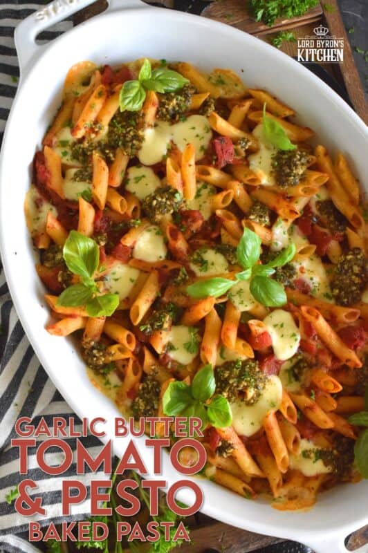 That title is a mouthful and that's exactly what you will have once you prepare this Garlic Butter Tomato and Pesto Baked Pasta in your home! Perfectly cooked pasta is flavoured with both seasoned tomatoes and basil pesto and baked with garlic butter and bocconcini until melted and gooey. This just might be my new favourite way to make pasta! #bakedpasta #pasta #casserole #ziti #basil #pesto #cheesy #garlicbutter