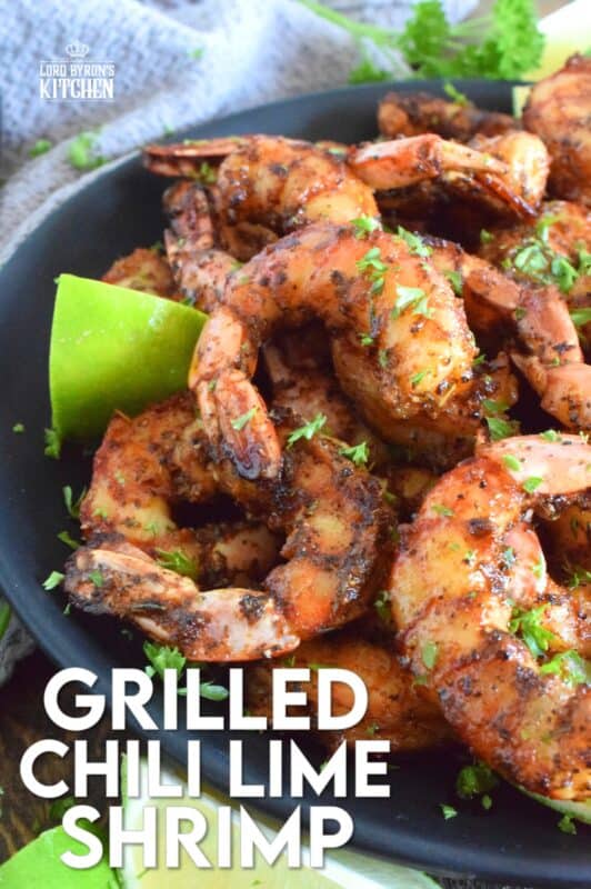 Marinated in a mixture of warming dried herbs and spices with a splash of olive oil and a spritz of fresh lime juice, these Grilled Chili Lime Shrimp are bursting with flavour! Quickly grilled over high heat to get a good sear and colour without the risk of overcooking makes it hard to stop from eating them all! #grilled #shrimp #chililime #lime #jumboshrimp