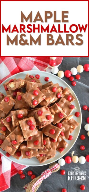 Prepared with chocolate, maple flavoured marshmallows, candy, and more, Maple Marshmallow M&M Bars are a cross between homemade fudge and a store-bought candy bar. Whip up a batch and keep them in your freezer. They are super delicious when eaten frozen on a cold, summer day! #marshmallow #maple #nobake #canadaday #fudge #redandwhite #candy