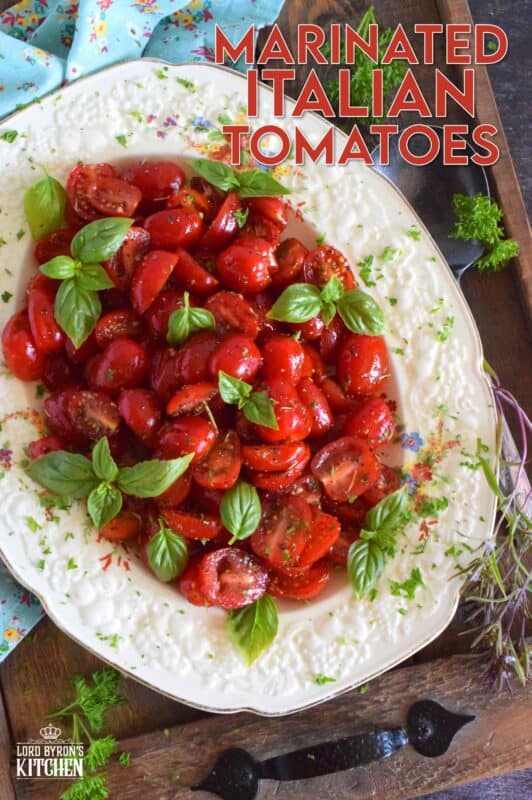 Cherry tomatoes are halved and marinated in a sweet and savoury blend of olive oil, vinegar, honey, and Italian seasoning. Topped with fresh basil leaves, these Marinated Italian Tomatoes make a delicious side dish, salad, or a topping for grilled baguette. #tomatoes #summerfresh #locallygrown #sides #marinated #salad #italian