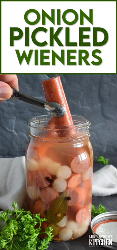 The easy to do recipe combines the flavour of the classic highway gas station pickled wieners with the bright, tart and sweet flavour of jarred pickled onions. Keep a jar in your fridge at all times for a quick snack or an easy lunch served with cheese and crackers! #pickled #wieners #cocktail #onions #pickledwieners