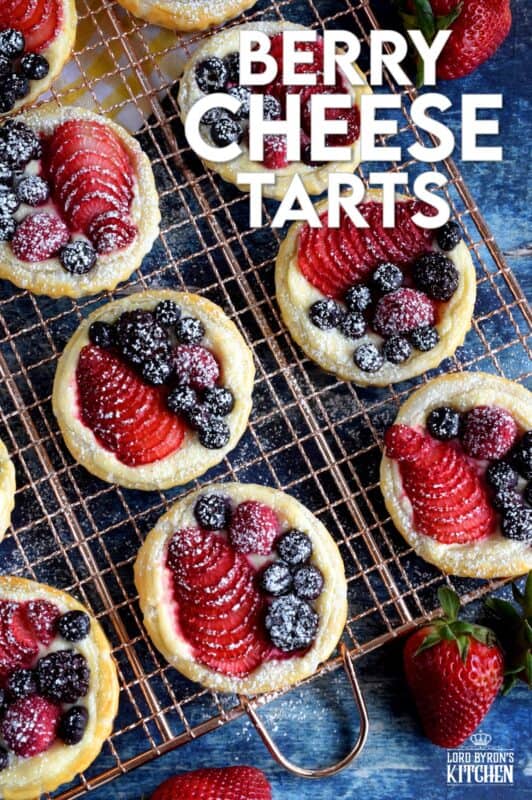 Transform store-bought, frozen sheets of puff pastry into these delightful little tarts filled with fresh berries and a lemony cream cheese filling! Use your favourite berries or fruit and then try to eat just one - it's nearly an impossible feat! #puffpastry #berries #4thofjuly #recipes #summer #creamcheese #tarts #tartlets #fruit