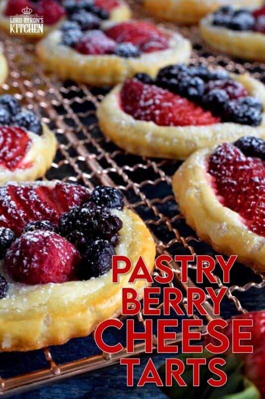 Transform store-bought, frozen sheets of puff pastry into these delightful little tarts filled with fresh berries and a lemony cream cheese filling! Use your favourite berries or fruit and then try to eat just one - it's nearly an impossible feat! #puffpastry #berries #4thofjuly #recipes #summer #creamcheese #tarts #tartlets #fruit