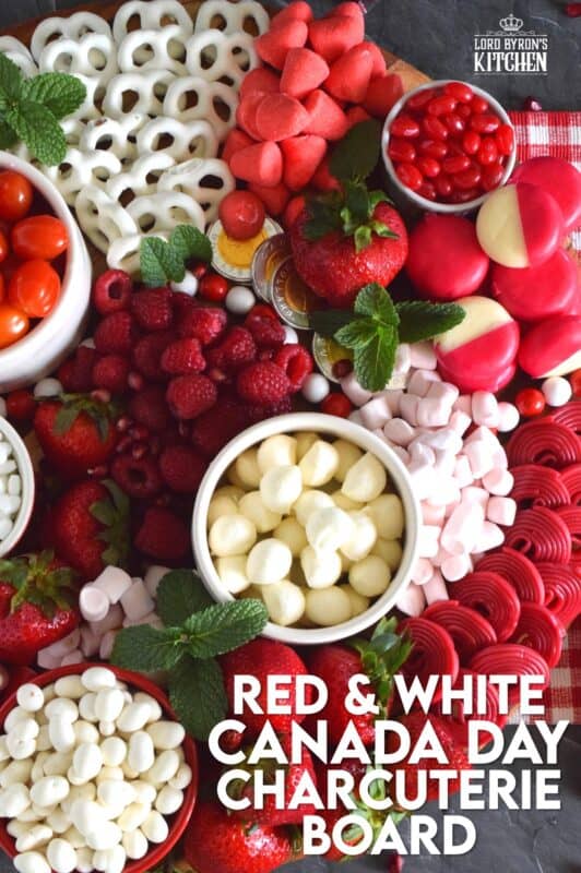 Gather together a bunch of red and white snack foods to assemble this super easy Canada Day Charcuterie Board! Your friends and family will love filling up on these festive snacks. Set the board down right into the middle of your patio table, and let everyone help themselves! All you need is a bunch of napkins and lots of ice cold drinks! Happy Canada Day! #canadaday #canada #charcuterie #redandwhite #festive #snacks