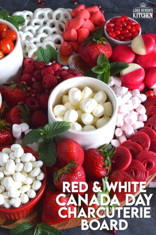 Gather together a bunch of red and white snack foods to assemble this super easy Canada Day Charcuterie Board! Your friends and family will love filling up on these festive snacks. Set the board down right into the middle of your patio table, and let everyone help themselves! All you need is a bunch of napkins and lots of ice cold drinks! Happy Canada Day! #canadaday #canada #charcuterie #redandwhite #festive #snacks