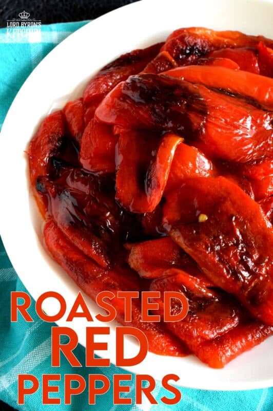 Roasted Red Peppers are a versatile condiment, ingredient, and topping. The ways to use Roasted Red Peppers and endless, and making your own is both easy and fun! If you don't grow your own, buy a bunch when there on sale and make your own roasted peppers at home! #redpeppers #roastedredpeppers #antipasto #canning #bellpeppers #preserving