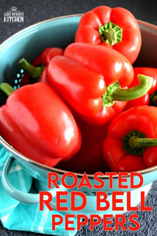 Roasted Red Peppers are a versatile condiment, ingredient, and topping. The ways to use Roasted Red Peppers and endless, and making your own is both easy and fun! If you don't grow your own, buy a bunch when there on sale and make your own roasted peppers at home! #redpeppers #roastedredpeppers #antipasto #canning #bellpeppers #preserving