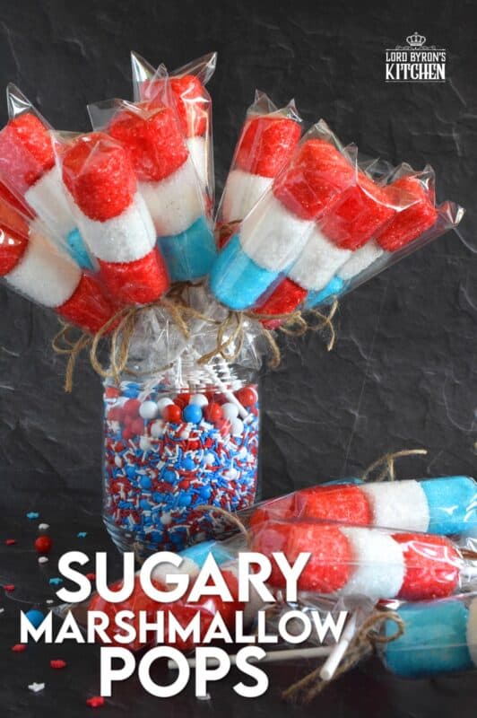 Young kids and old kids alike will love these Sugary Marshmallow Pops! They're easy to prepare and a lot of fun too. It's like making a craft that you can eat when your finished working on it. Crafting and eating - the best of both worlds combined! #marshmallows #marshmallowpops #sprinkles #4thofjuly #canadaday