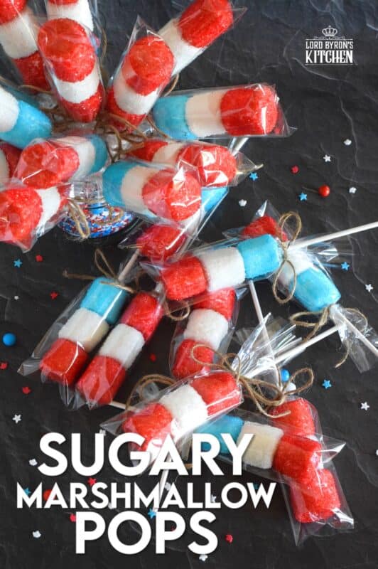 Young kids and old kids alike will love these Sugary Marshmallow Pops! They're easy to prepare and a lot of fun too. It's like making a craft that you can eat when your finished working on it. Crafting and eating - the best of both worlds combined! #marshmallows #marshmallowpops #sprinkles #4thofjuly #canadaday