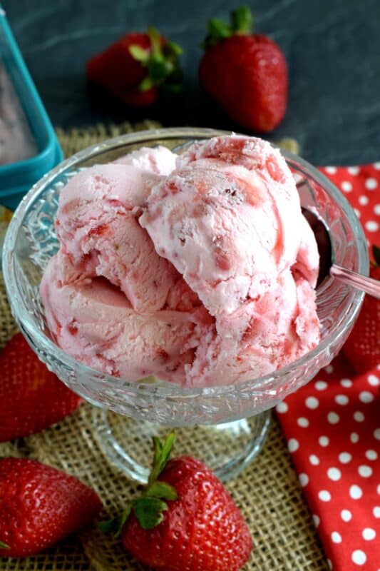 For the intense and dedicated strawberry enthusiast - Strawberries and Cream No Churn Ice Cream is about to become your newest obsession! It's strawberry season, so make this ice cream now with fresh, locally grown strawberries! #nochurn #icecream #strawberriesandcream #homemadeicecream
