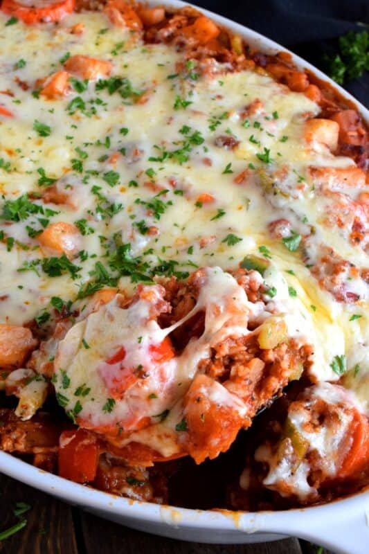 A blast from the past recipe that will fill your belly and comfort all of your food cravings; Shipwreck Casserole Dinner is not only super delicious, but also very easy to prepare, and as an added bonus, it's loaded with veggies too! #casserole #shipwreck #seven #layer #dinner
