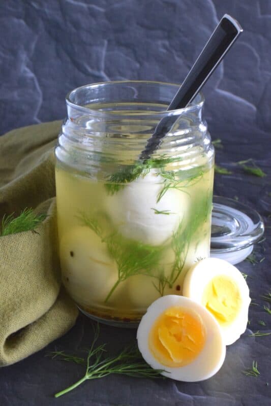 Dill Pickled Eggs can be found in the snack section of many on-the-go style stores, especially those found on the highway. They're fast and easy and delicious, but quite costly! Use my recipe to make a whole batch at home for a fraction of the cost! #pickledeggs #dillpickle #picklejuice #pickled #hardboiled #eggs