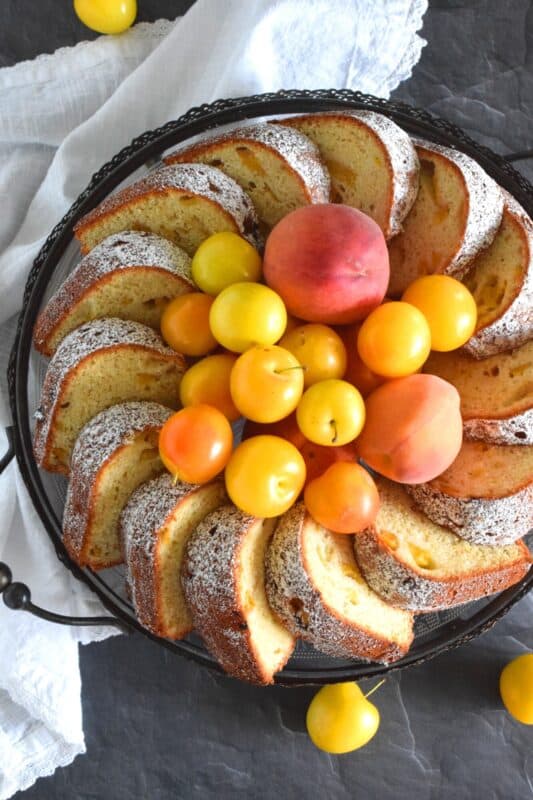 Peach and Plum Cake is an easy cake to prepare and it doesn't require any decorating skills at all! Allow the flavour of the fresh peaches and plums to be the highlight of the cake. You can dress it up with frostings or glaze, but it really isn't needed! Soft, moist, sweet, and tart, this cake is best served with a hot coffee on a lazy summer afternoon. #cake #bundt #peach #plum #stonefruit #summerfresh