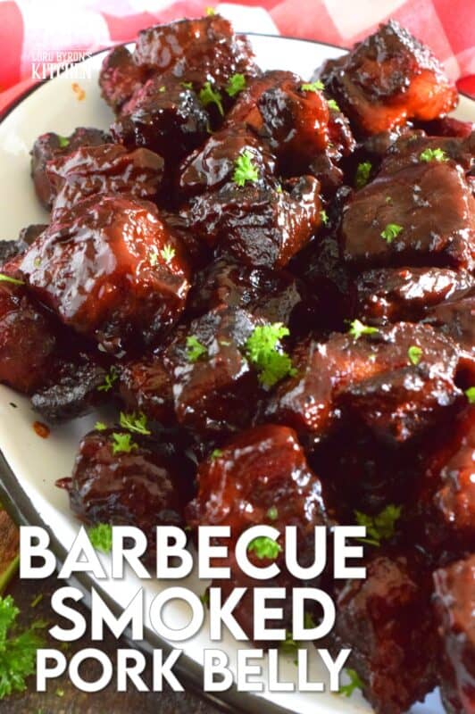 Barbecued Smoked Pork Belly Burnt Ends are prepared with trimmed and cubed pork belly which has been dry rubbed with a sweet spice blend. The pork is smoked with apple wood before being tossed with sauce and returned to the smoker to char up. #porkbelly #smoked #smoker #smokedrecipes #bbq #smokedpork #burntends