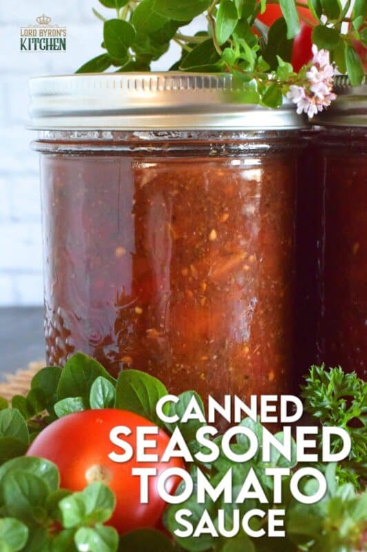 Canned Seasoned Tomato Sauce is prepared with summer fresh, locally grown tomatoes, and seasoned with classic tomato sauce ingredients like onion, garlic, basil, and oregano. Not only will you contain all of that fresh tomato flavour, but you'll cut dinner time prep in half! #tomatosauce #tomatoes #canning #preserves #seasonedsauce #tomato