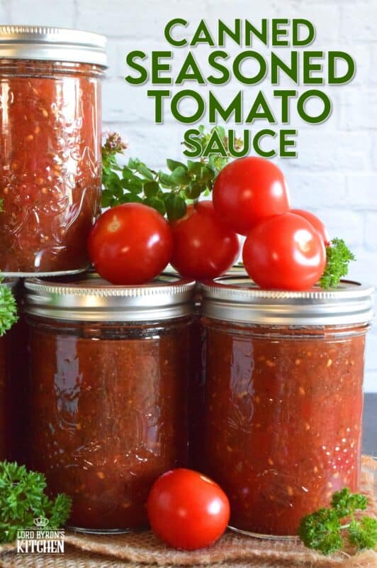 Canned Seasoned Tomato Sauce is prepared with summer fresh, locally grown tomatoes, and seasoned with classic tomato sauce ingredients like onion, garlic, basil, and oregano. Not only will you contain all of that fresh tomato flavour, but you'll cut dinner time prep in half! #tomatosauce #tomatoes #canning #preserves #seasonedsauce #tomato