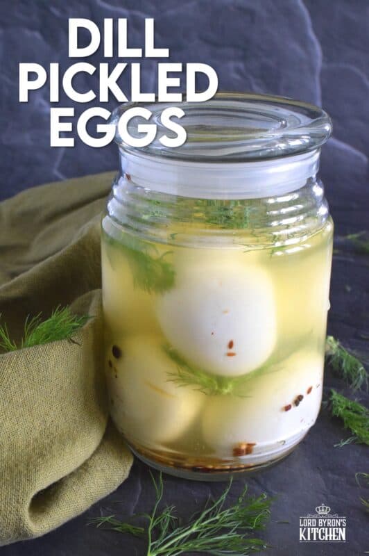Dill Pickled Eggs can be found in the snack section of many on-the-go style stores, especially those found on the highway. They're fast and easy and delicious, but quite costly! Use my recipe to make a whole batch at home for a fraction of the cost! #pickledeggs #dillpickle #picklejuice #pickled #hardboiled #eggs