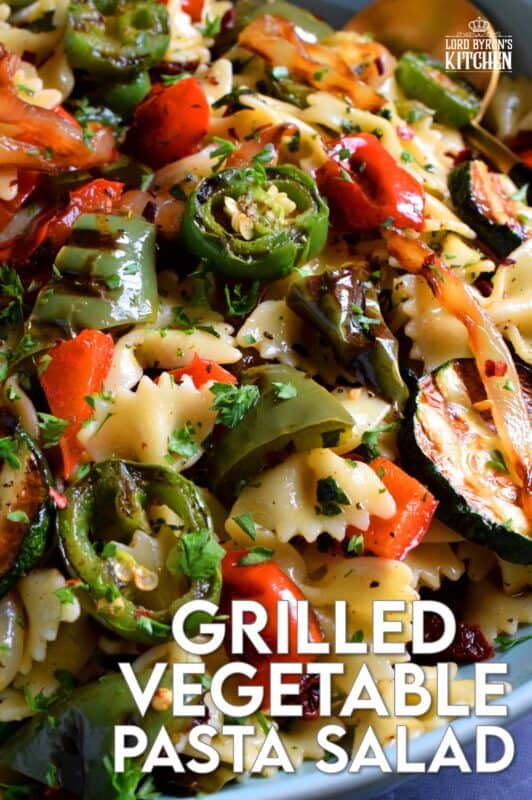 Perfectly charred bell peppers, onions, jalapenos, and zucchini make up this Grilled Vegetable Pasta Salad. Tossed with a simple, easy to make, light, oil-based homemade dressing, this is a perfect summer side! Serve warm or at room temperature! #grilled #vegetable #veggies #pasta #salad #summer #side #picnic #backyard