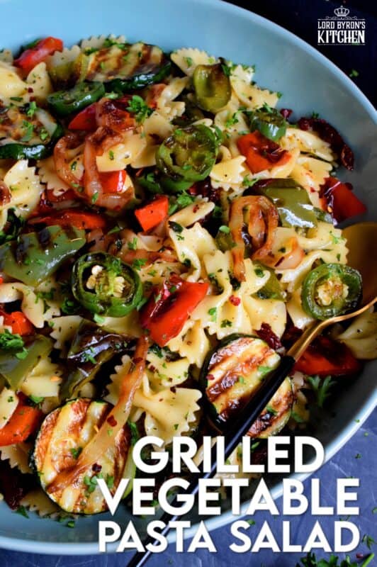 Perfectly charred bell peppers, onions, jalapenos, and zucchini make up this Grilled Vegetable Pasta Salad. Tossed with a simple, easy to make, light, oil-based homemade dressing, this is a perfect summer side! Serve warm or at room temperature! #grilled #vegetable #veggies #pasta #salad #summer #side #picnic #backyard