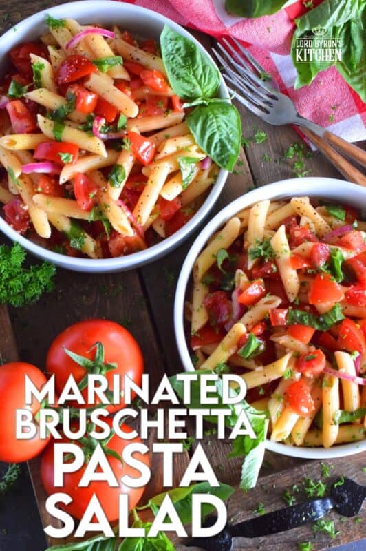 This is the ultimate summer pasta salad! Fresh tomatoes are marinated with olive oil, garlic, red onions, and balsamic vinegar before being tossed with cooked pasta and fresh basil. A terrific way to use your best summer fresh tomatoes! #pasta #summerpasta #bruschetta #pastasalad #tomatoes #summertomatoes #tomatorecipes