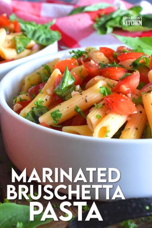 This is the ultimate summer pasta salad! Fresh tomatoes are marinated with olive oil, garlic, red onions, and balsamic vinegar before being tossed with cooked pasta and fresh basil. A terrific way to use your best summer fresh tomatoes! #pasta #summerpasta #bruschetta #pastasalad #tomatoes #summertomatoes #tomatorecipes