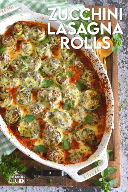 A little lighter on the carbs, Zucchini Lasagna Rolls are prepared by rolling thinly sliced zucchini with spinach, egg, three cheeses, and seasonings. Baked in marinara sauce, don't be fooled by this healthier dish; it is both filling and robust! #zucchini #zucchinirolls #lasagna #lasagnarolls #zucchinilasagna #lowcarb