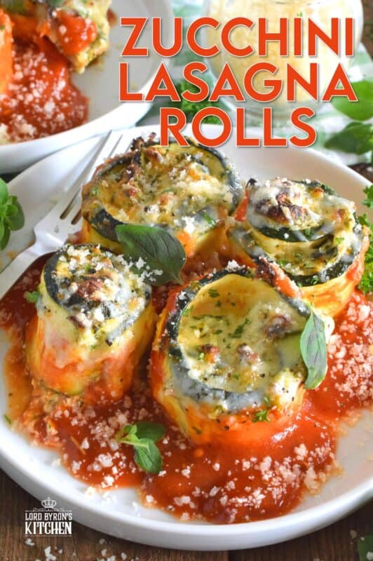 A little lighter on the carbs, Zucchini Lasagna Rolls are prepared by rolling thinly sliced zucchini with spinach, egg, three cheeses, and seasonings. Baked in marinara sauce, don't be fooled by this healthier dish; it is both filling and robust! #zucchini #zucchinirolls #lasagna #lasagnarolls #zucchinilasagna #lowcarb