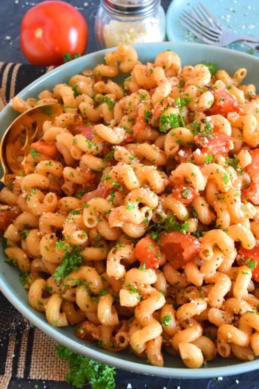 Tomato Balsamic Pasta is prepared with chopped fresh tomatoes and garlic, lots of grated parmesan cheese, and perfectly cooked pasta. With an olive oil and balsamic base, this pasta is super easy, delightfully fresh, and tastes like summer in a bowl! #summerfresh #tomatoes #vegetarian #pasta #oilandbalsamic #freshtomatoes