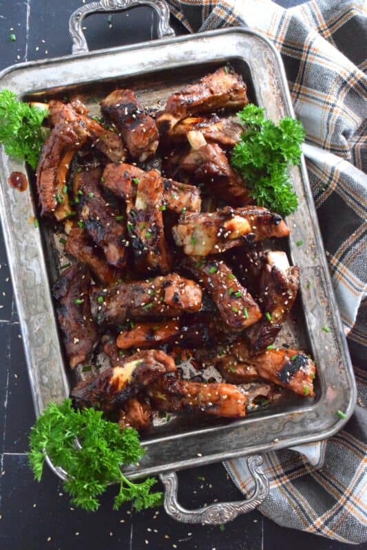 If you have never tried ribs in an instant pot, what are you waiting for!? Grilled Honey Soy Pork Ribs are pressure cooked and then grilled to perfection in a sweet sauce consisting of honey, dark soy sauce, rice vinegar, mirin, and sesame oil. They are super tender and fall-off-the-bone perfect! #ribs #grilled #instantpot #asian #pork #porkribs