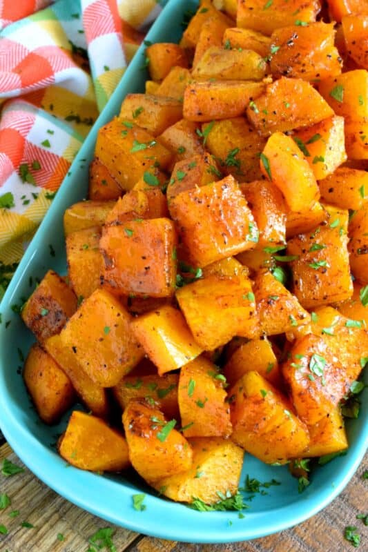 Maple syrup and roasted root vegetables go together like bread and butter.  If you need proof, try this Maple Glazed Squash.  Using a total of four ingredients, squash is transformed into a fall side dish worth its weight in gold!  Whatever you do, don't skip out on adding the cinnamon! #roasted #butternut #squash #maple #syrup #glazed