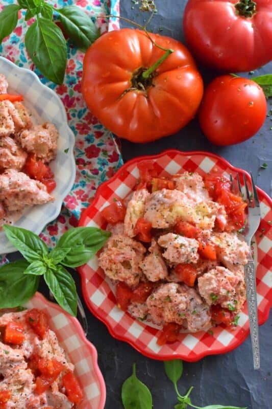 Traditionally prepared with an oil and vinegar dressing, my Tomato Panzanella Salad is prepared with the ripest and freshest tomatoes you can get your hands on, lots of toasted, hand-torn bread, seasonings, and mayonnaise. This salad is so simple, yet so delicious! #summerfresh #tomatoes #panzanella #salad #mayo