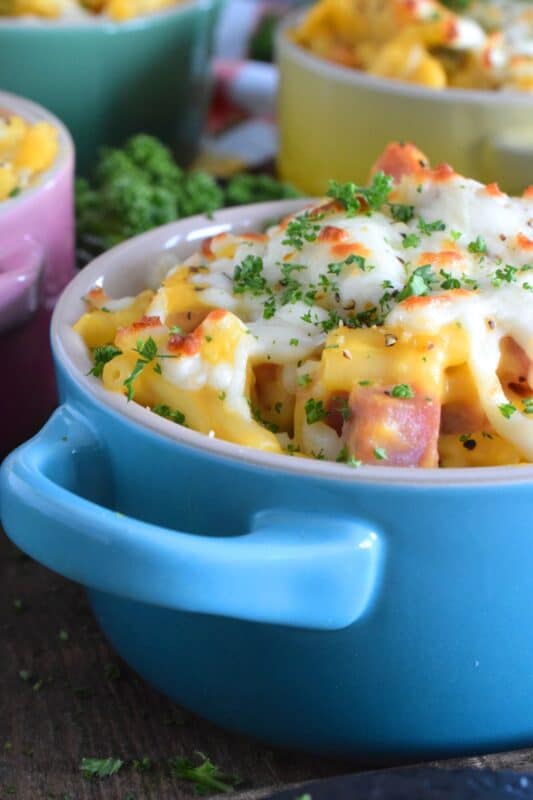 Kraft Dinner Casserole is a great family dinner option that won't break the bank and is so quick and easy to prepare. Starting with a box of Kraft Dinner, some ham, a can of soup, and grated cheese, this delicious dinner can be on the table in about 30 minutes! #casserole #ham #kraftdinner #macandcheese