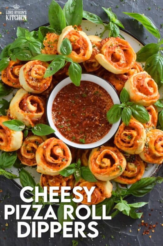 Whip up a batch of these Cheesy Pizza Roll Dippers quickly and easily with the help of store-bought, frozen pizza dough! Layer the dippers with lots of cheese, a quick and easy homemade pizza sauce, and toppings of your choice! These puff up in the oven and are brown and slightly crispy on the bottom with ooey-gooey cheese bubbling out of the top. Complete with a delicious marinara dip, who could resist? #pizza #pizzarolls #rollups #dip #dippers