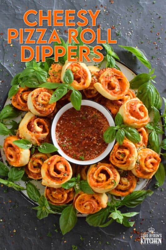Whip up a batch of these Cheesy Pizza Roll Dippers quickly and easily with the help of store-bought, frozen pizza dough! Layer the dippers with lots of cheese, a quick and easy homemade pizza sauce, and toppings of your choice! These puff up in the oven and are brown and slightly crispy on the bottom with ooey-gooey cheese bubbling out of the top. Complete with a delicious marinara dip, who could resist? #pizza #pizzarolls #rollups #dip #dippers