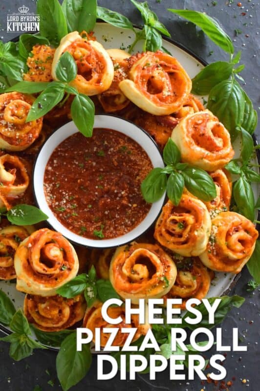 Whip up a batch of these Cheesy Pizza Roll Dippers quickly and easily with the help of store-bought, frozen pizza dough! Layer the dippers with lots of cheese, a quick and easy homemade pizza sauce, and toppings of your choice! These puff up in the oven and are brown and slightly crispy on the bottom with ooey-gooey cheese bubbling out of the top. Complete with a delicious marinara dip, who could resist? #pizza #pizzarolls #rollups #dip #dippers