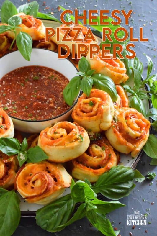 Whip up a batch of these Cheesy Pizza Roll Dippers quickly and easily with the help of store-bought, frozen pizza dough! Layer the dippers with lots of cheese, a quick and easy homemade pizza sauce, and toppings of your choice! These puff up in the oven and are brown and slightly crispy on the bottom with ooey-gooey cheese bubbling out of the top. Complete with a delicious marinara dip, who could resist? #pizza #pizzarolls #rollups #dip #dippers