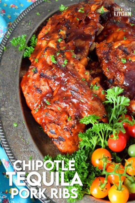 Super moist and tender pork ribs are first prepared in an instant pot and then brushed with a homemade chipotle tequila barbecue sauce. The ribs are then tossed on the grill until that delicious sauce becomes hot, sticky, and stuck to those gorgeous ribs by means of beautiful grill marks. Are you drooling yet? #chipotle #tequila #bbq #ribs #porkribs #pork