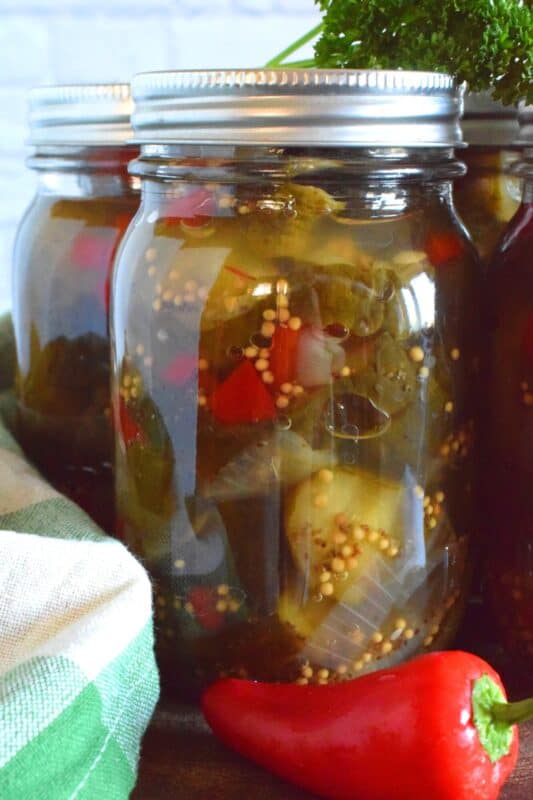 Bread and Butter Zucchini Pickles are one of my favourite condiments. Easy to prepare, and inexpensive too, this is a great recipe to prepare as gifts for friends or to stock your pantry for the winter months ahead. #breadandbutter #zucchini #pickles #preserves #sweet #masonjar